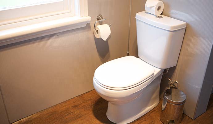 A clean white toilet in a bathroom