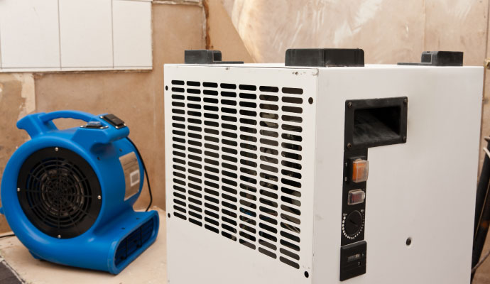 Commercial dehumidifier and air mover drying water damage