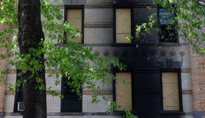 Boarded-up fire damaged commercial property