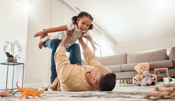 Man playing with his daughter