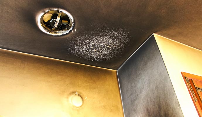 Smoke & soot damaged ceiling and wall