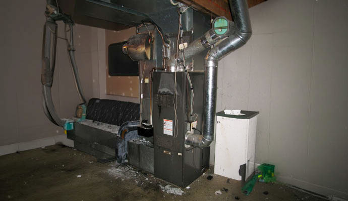 Fire-damaged basement furnace and HVAC unit