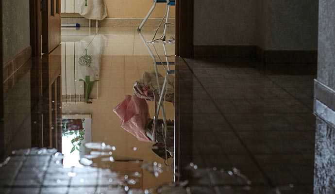 Flooded hallway broken pipe repair