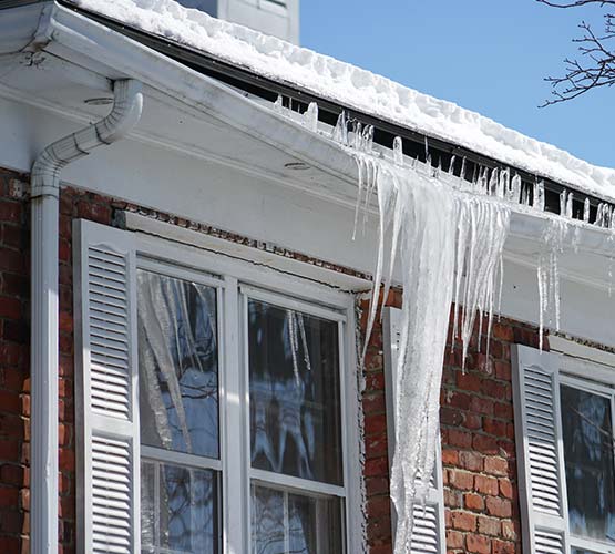 Heavy snow and ice damaged gutter