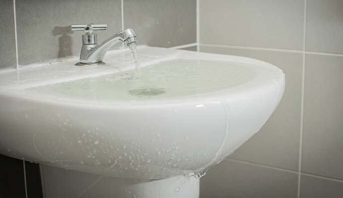 Overflowing bathroom sink