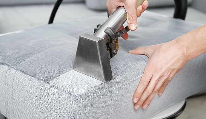 Professional cleaning upholstery using equipment