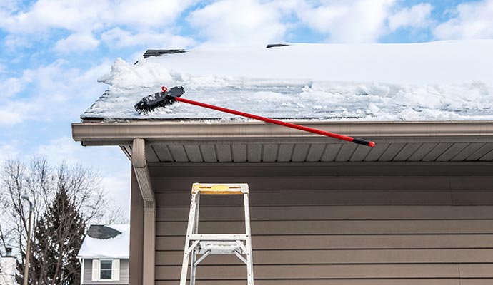 Snow damaged roof restoration service