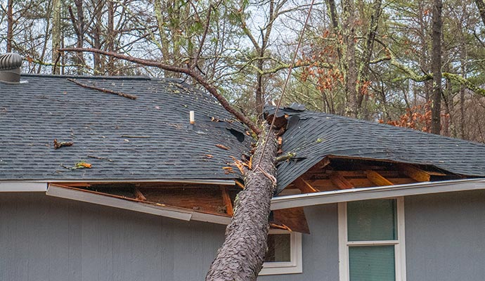 Storm damaged house roof