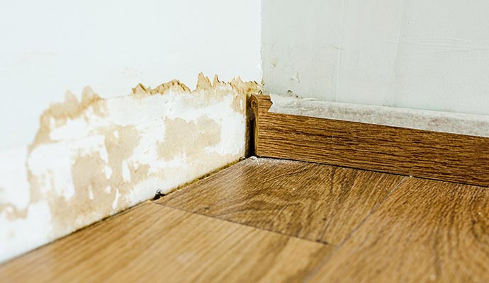Water damage to the wall corner from refrigerator leaks