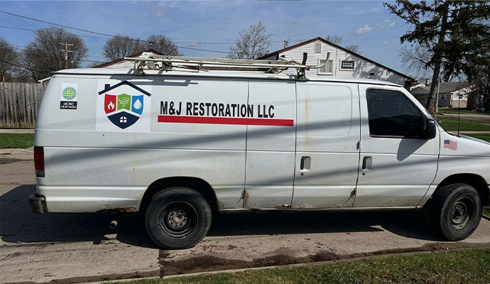 M&J Restoration service van