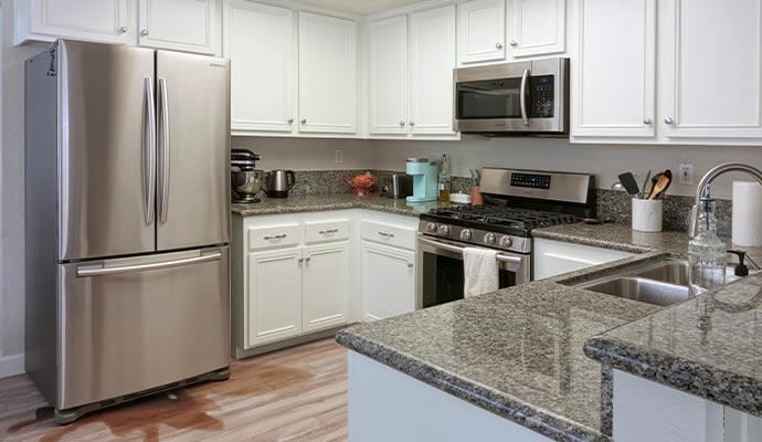 Water leaking from refrigerator onto kitchen floor
